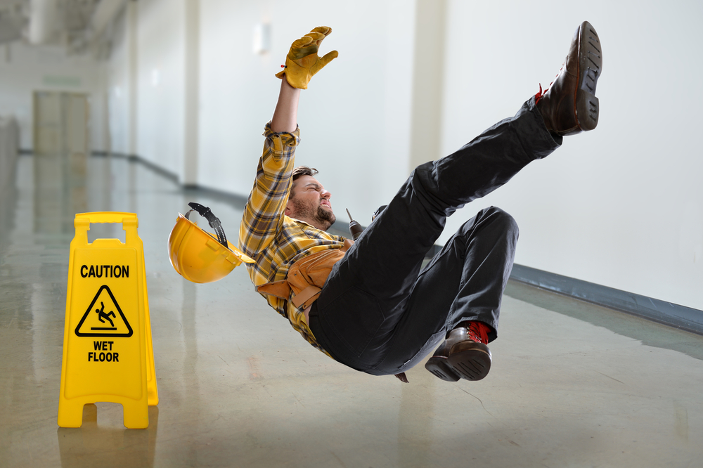 Photo of a Worker Falling on the Floor