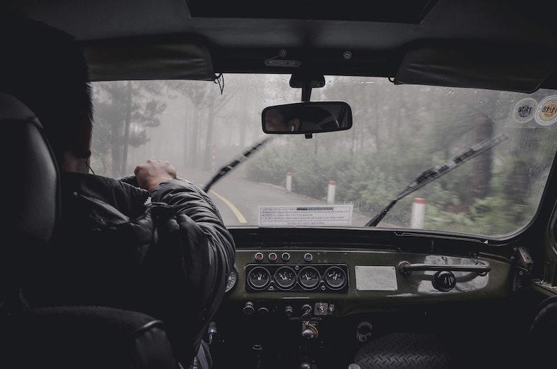 Truck Driver Behind The Wheel Photographed From The Inside