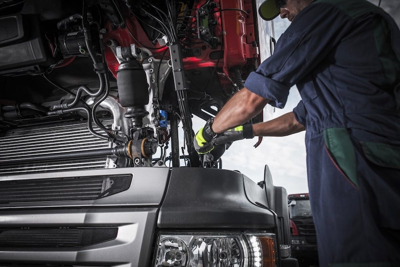 Mechanic Working On A Truck