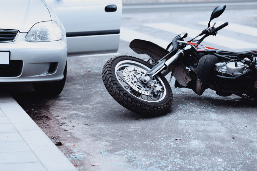 Photo of a Motorcycle Lying on the Ground