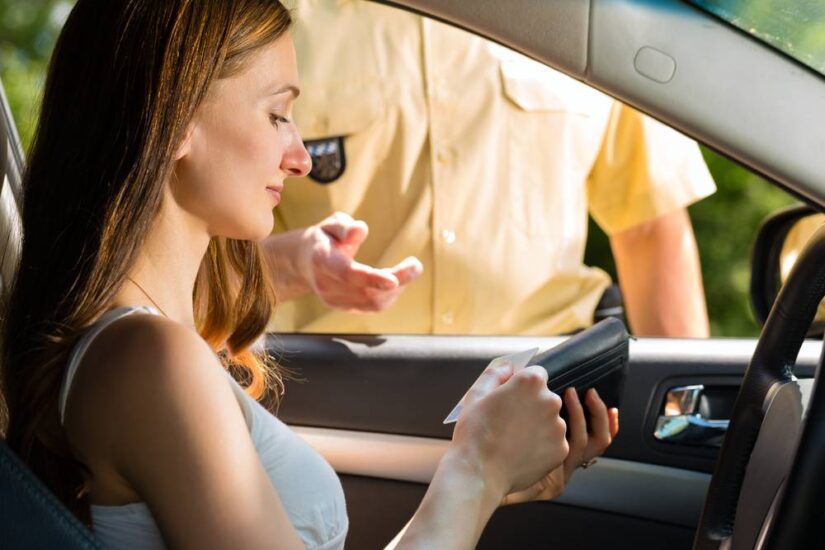 Photo of girl showing her dirvers licence.jpg